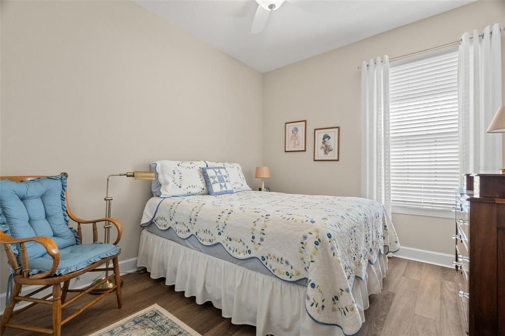 Bedroom 2 with luxury vinyl plank flooring