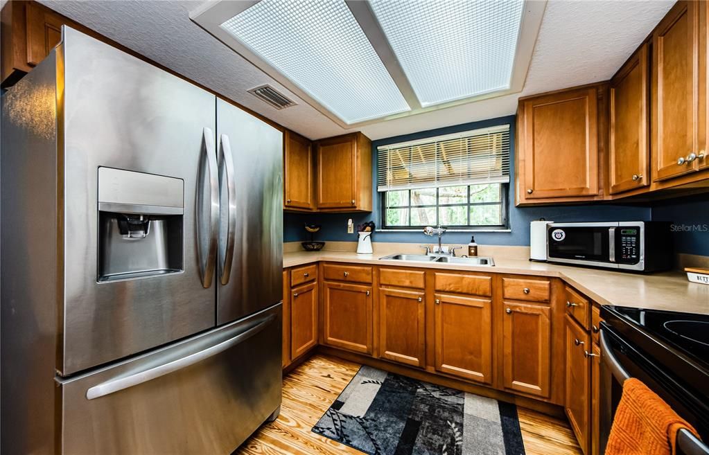 Kitchen, stainless appliances and solid wood cabinets.