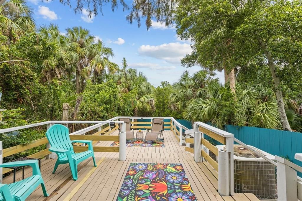 Open Deck Behind Covered Porch