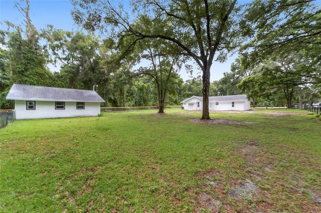 Back Corner of Property showing Garage & Main House