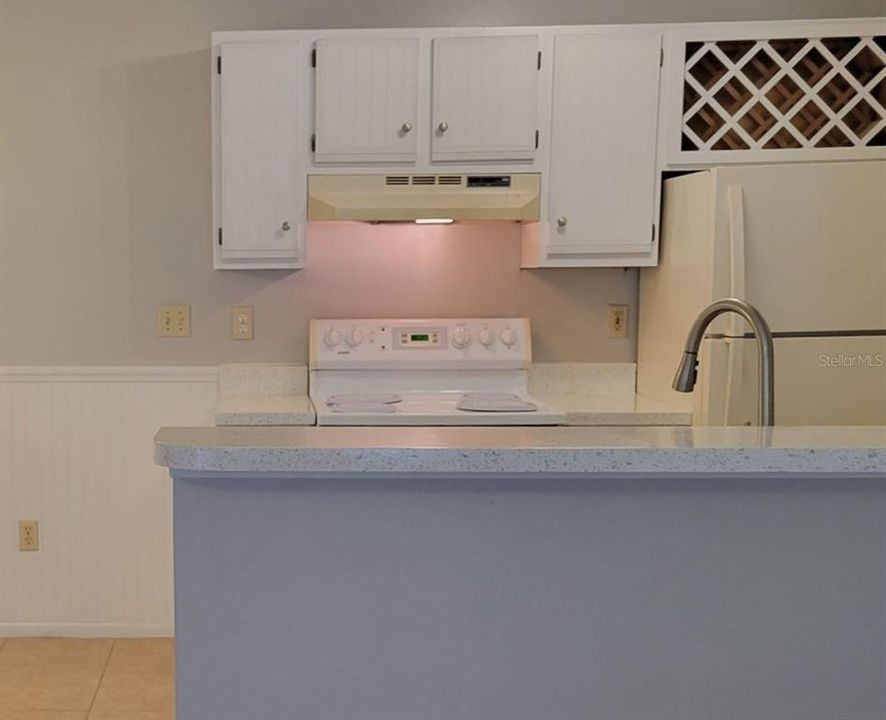 Breakfast bar looking into kitchen