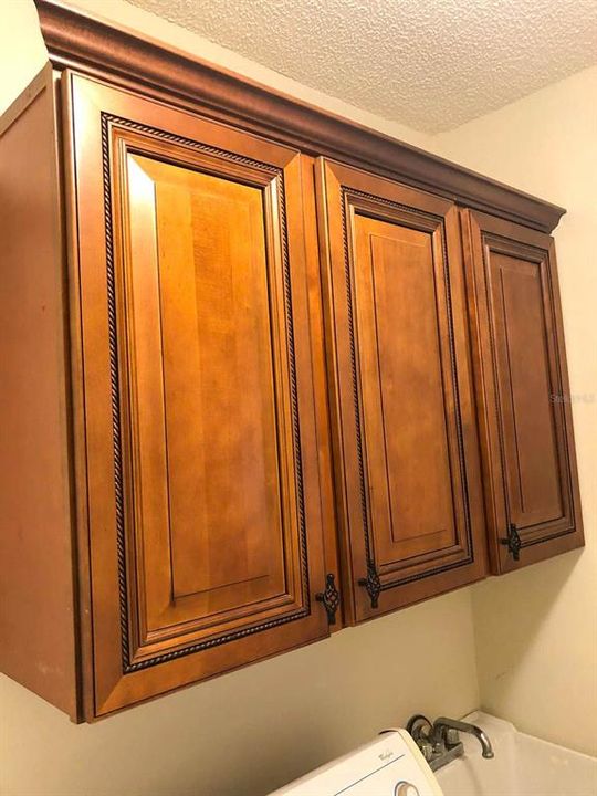 Wooden cabinets in the laundry area