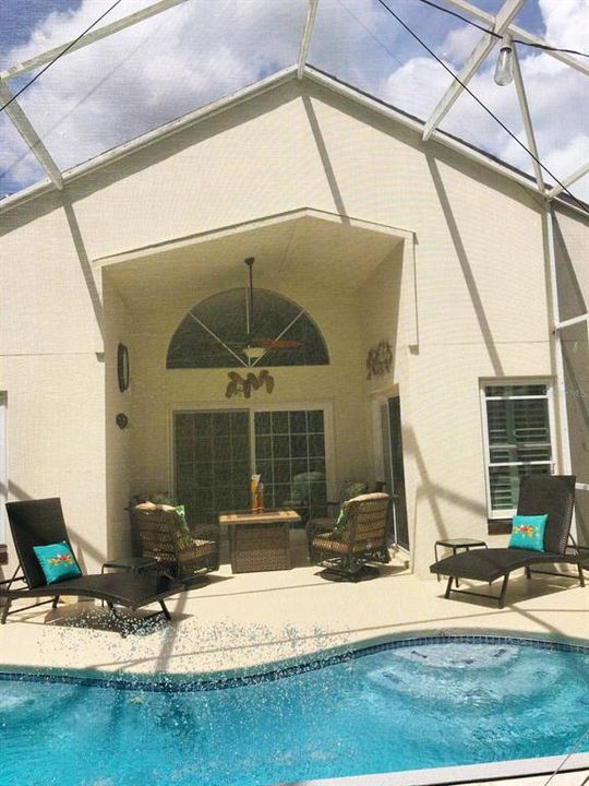 Poolside showing screened pool and pool patio