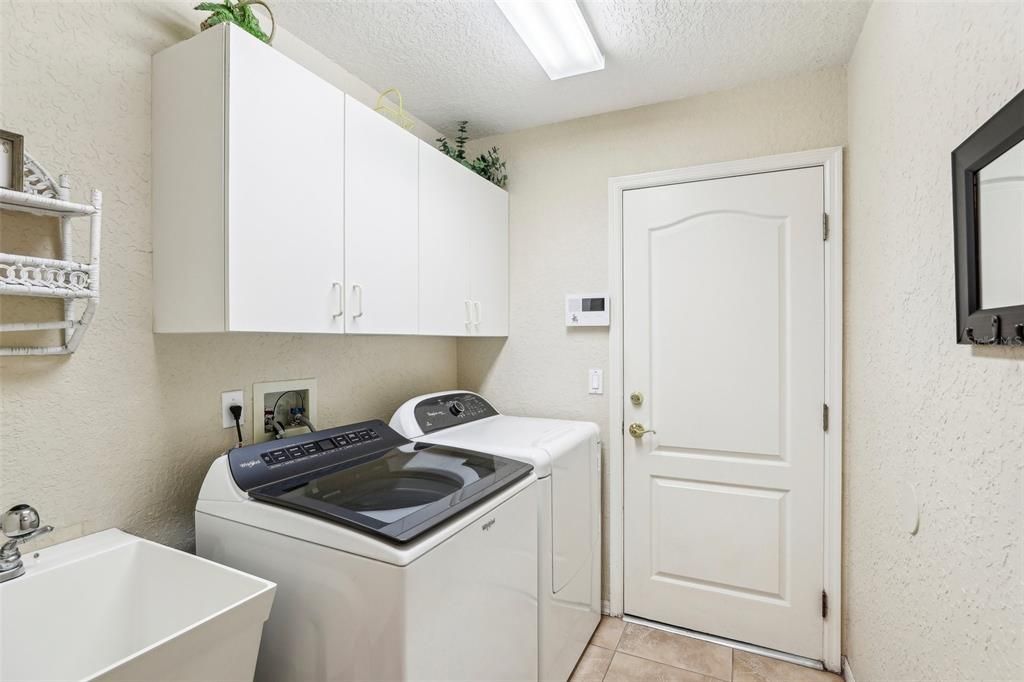 Interior laundry room with a utility sink!