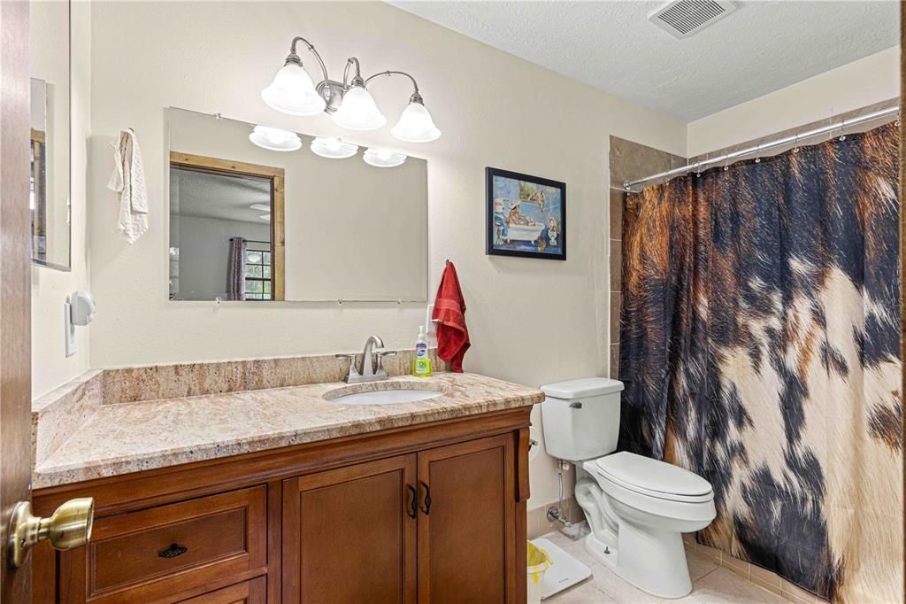 Primary bath with tiled walk in shower