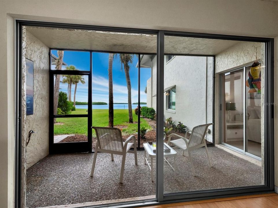 Enjoy the outdoors while being sheltered on the screened lanai overlooking Sarasota Bay.