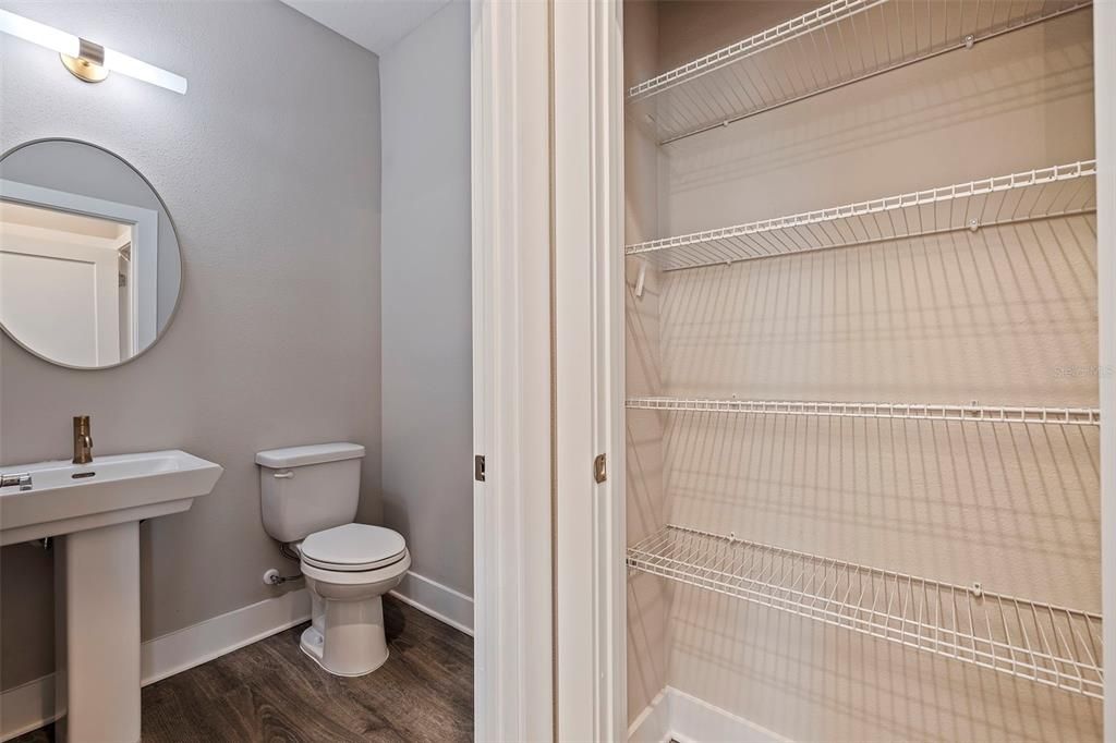 Guest bathroom and enclosed pantry