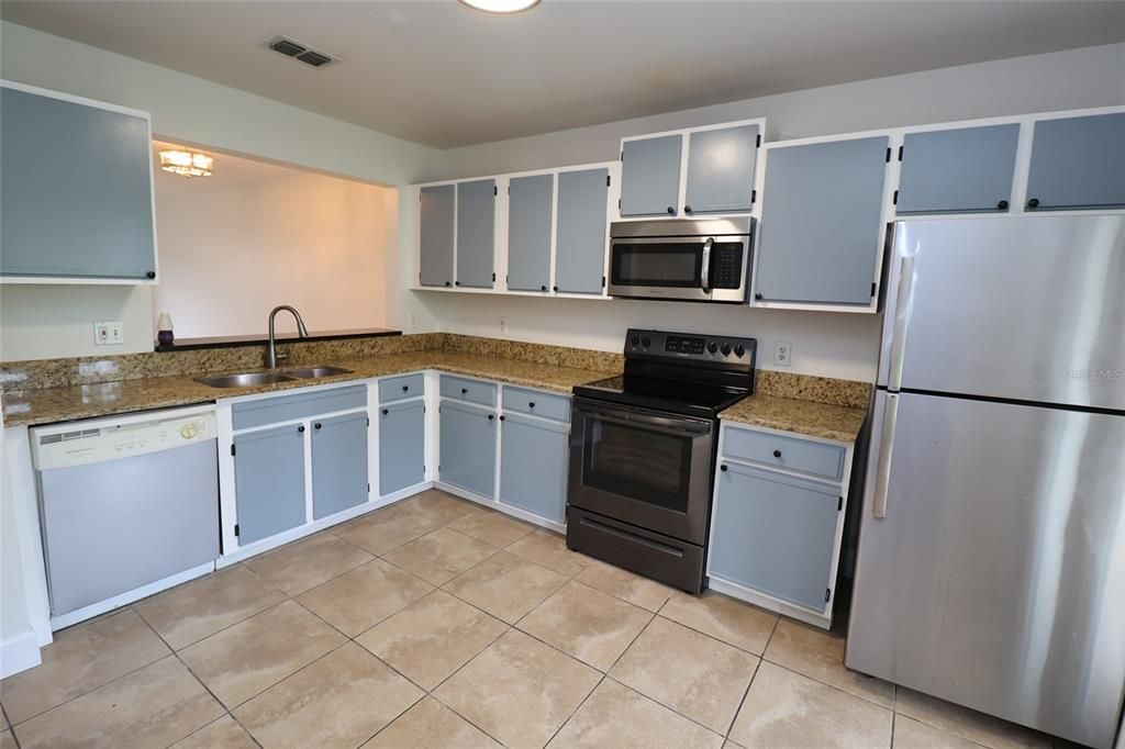 Kitchen has Ss appliances & granite counters