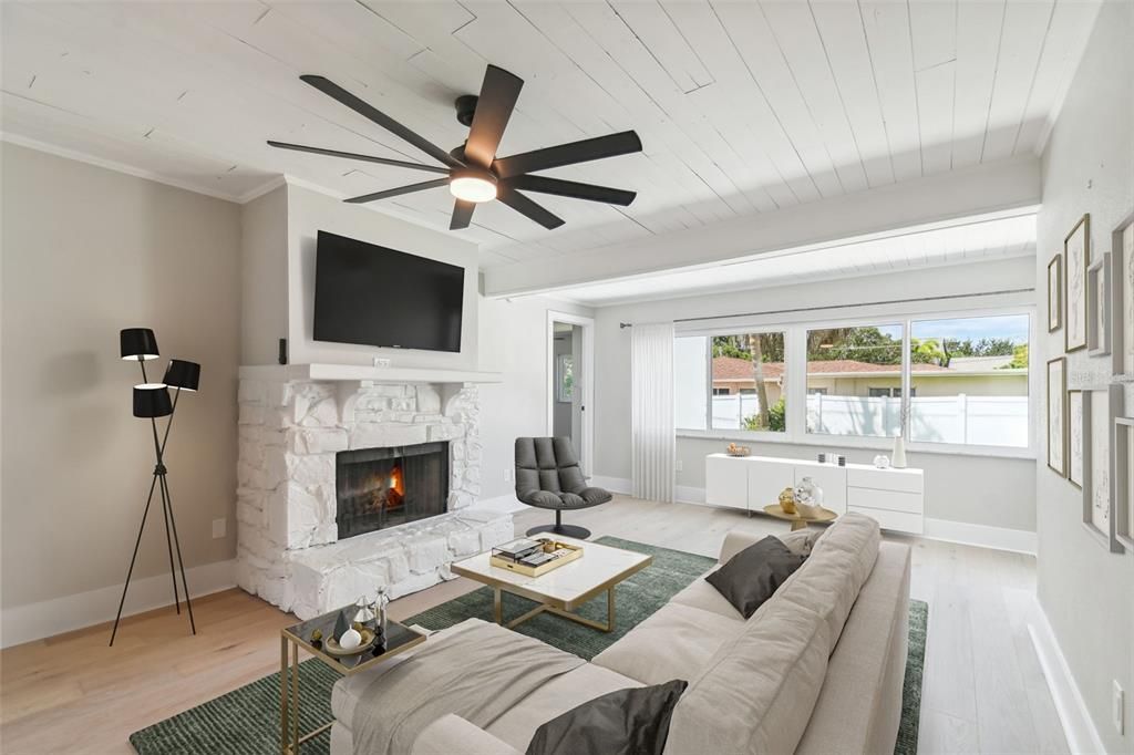 Family room overlooking the backyard with fireplace