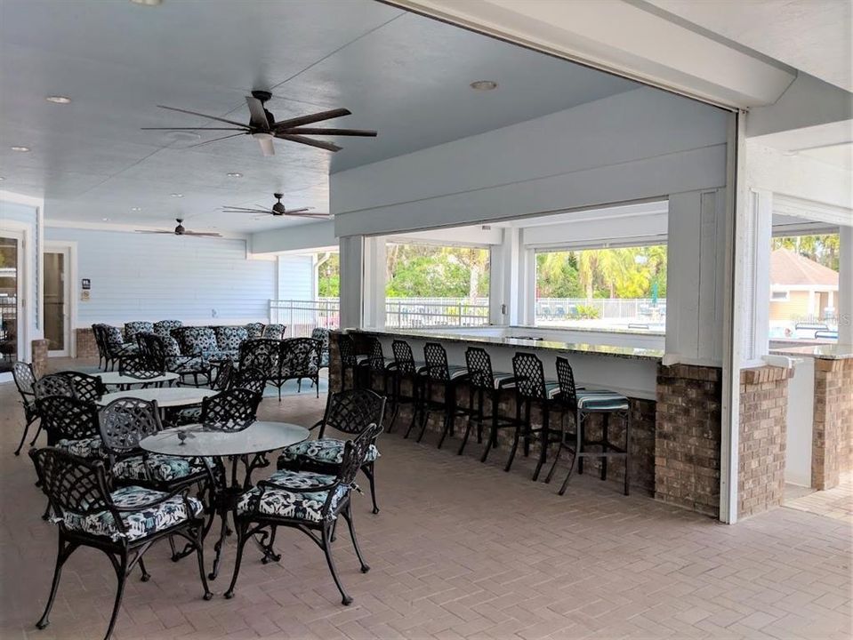 RIVERWOOD GATHERING AREA OVERLOOKING LARGE RESORT STYLE POOL