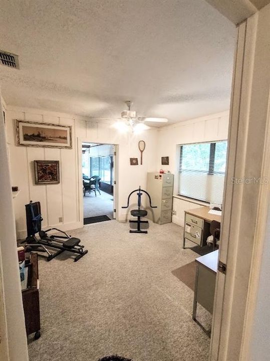 Additional room leads into the back yard screened in porch.