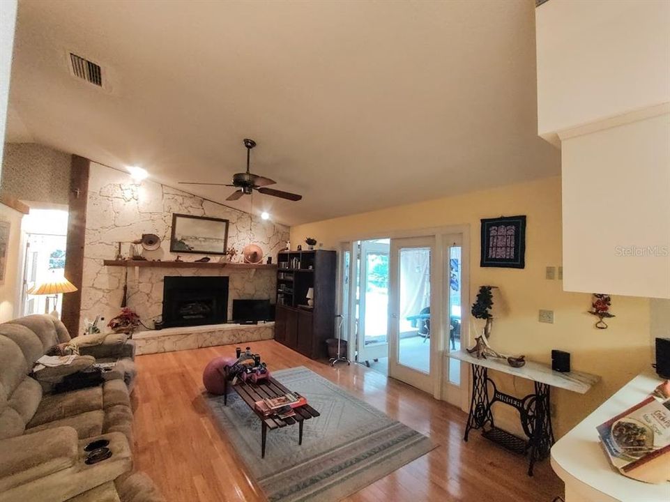 Family room, with Gas Fireplace and french doors that lead to back porch. This room could also be a formal dinning room.