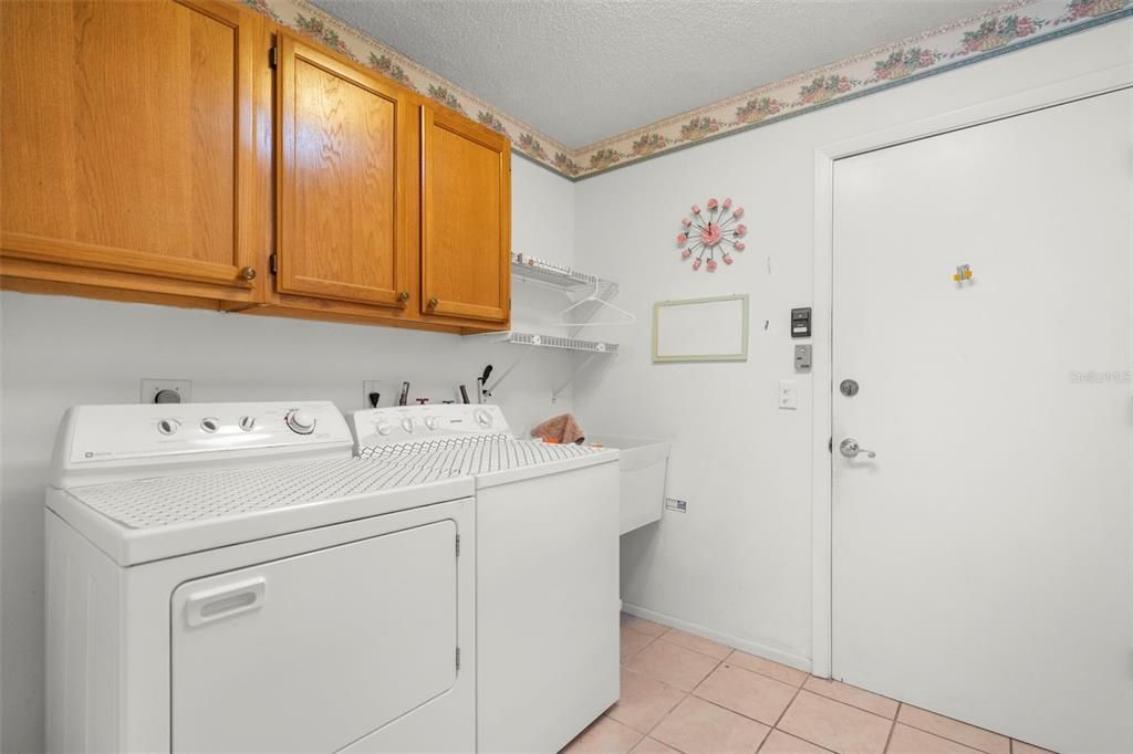 laundry room with overhead storage space