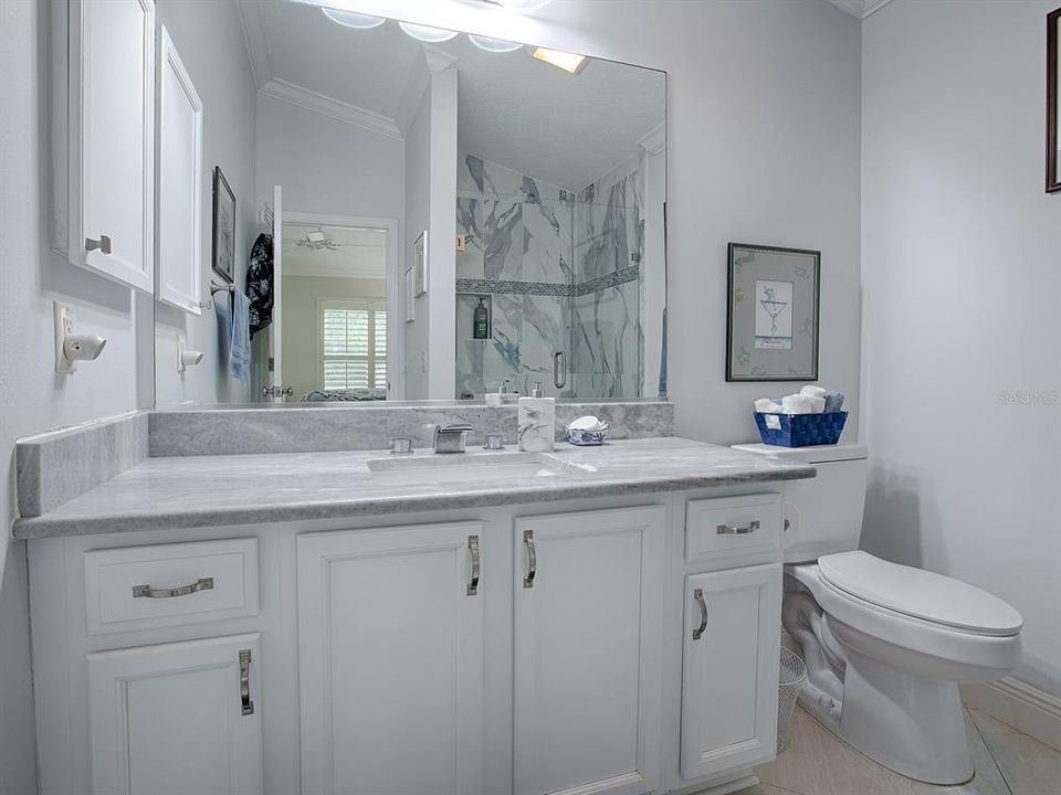 LOVELY UPGRADED PRIMATY BATH - GRANITE COUNTERTOPS, NEW FAUCET, FIXTURES, AND TOILET.