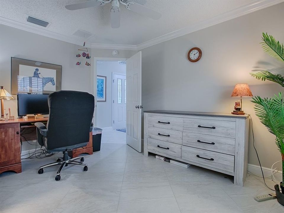 THIS GUEST ROOM IS IN THE SAME HALLWAY ACROSS FROM THE FRONT DOOR.  YOU'LL FIND BEAUTIFUL DIAGONAL TILE FLOORING THROUGHOUT THE HOME.