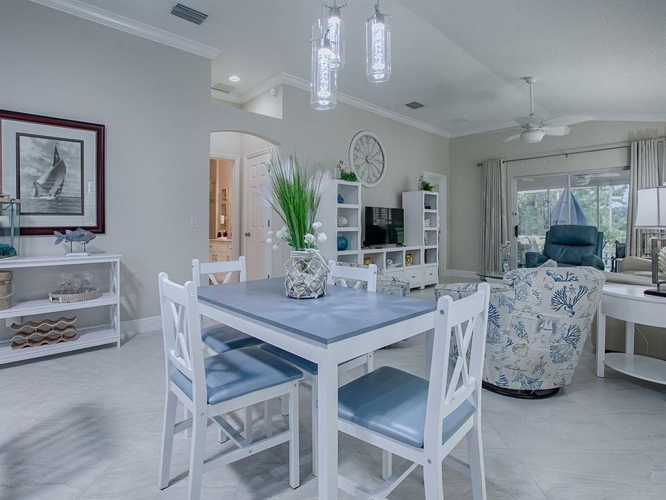 CROWN MOLDING THROUGHOUT THIS LOVELY VILLA. THE ARCHWAY LEADS TO THE 2ND GUEST ROOM AND GUEST BATH.