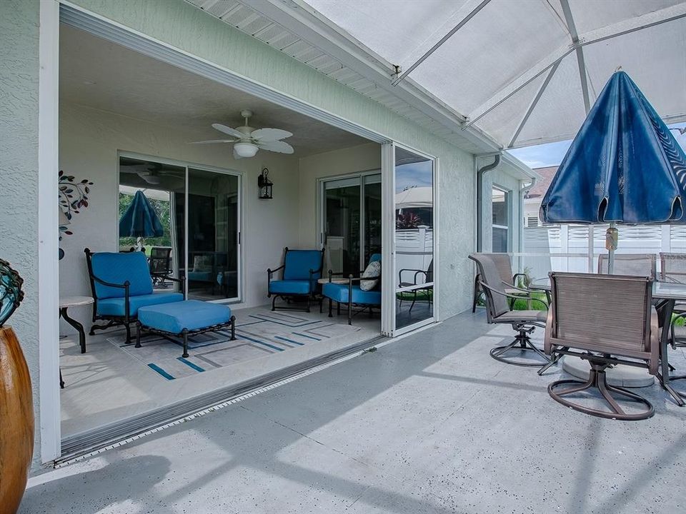 ENCLOSED LANAI WITH STACKBACK DOORS.