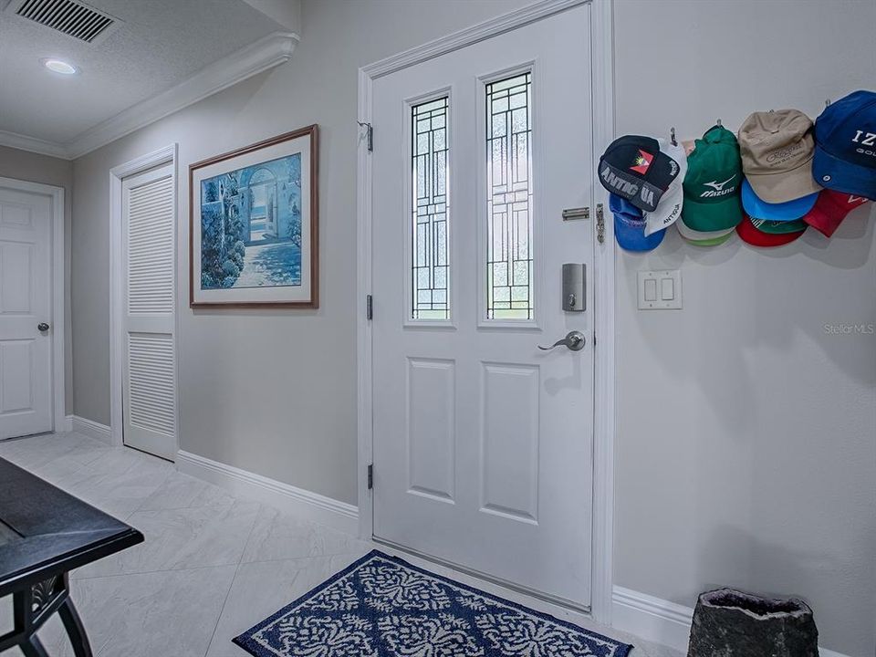 THE LOUVERED DOOR IS THE INSIDE LAUNDRY ROOM - THE DOOR AT THE END OF THE HALLWAY IS THE GARAGE.