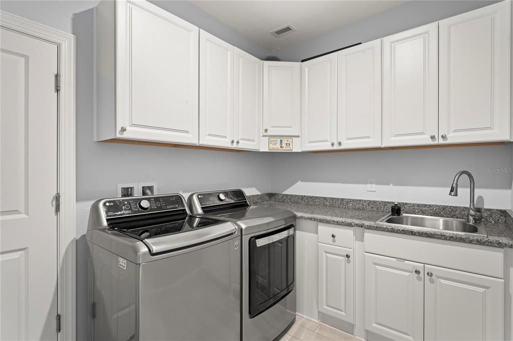 Custom cabinets finished in Laundry with sink