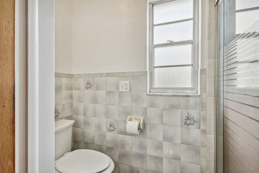 Bathroom 2 with heat lamps in ceiling