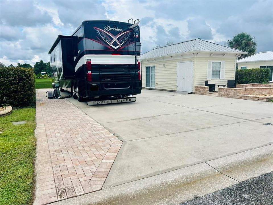 Additional pavers extend living and parking area