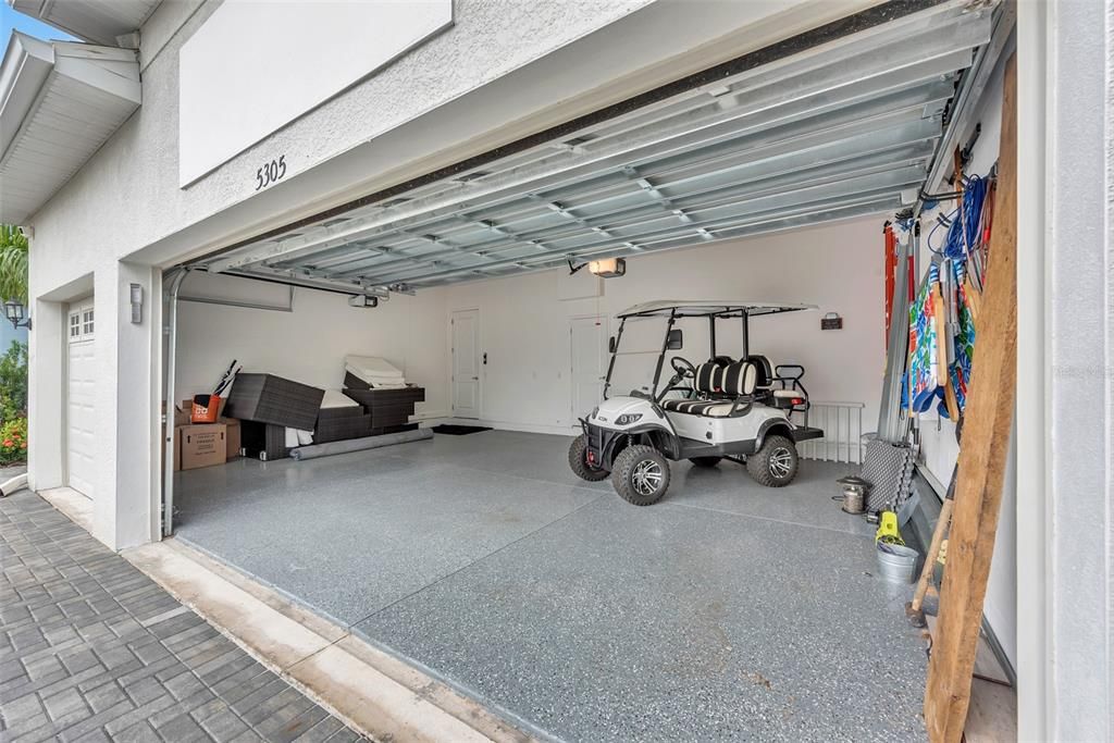 3 car garage with golf cart that tenant may use.