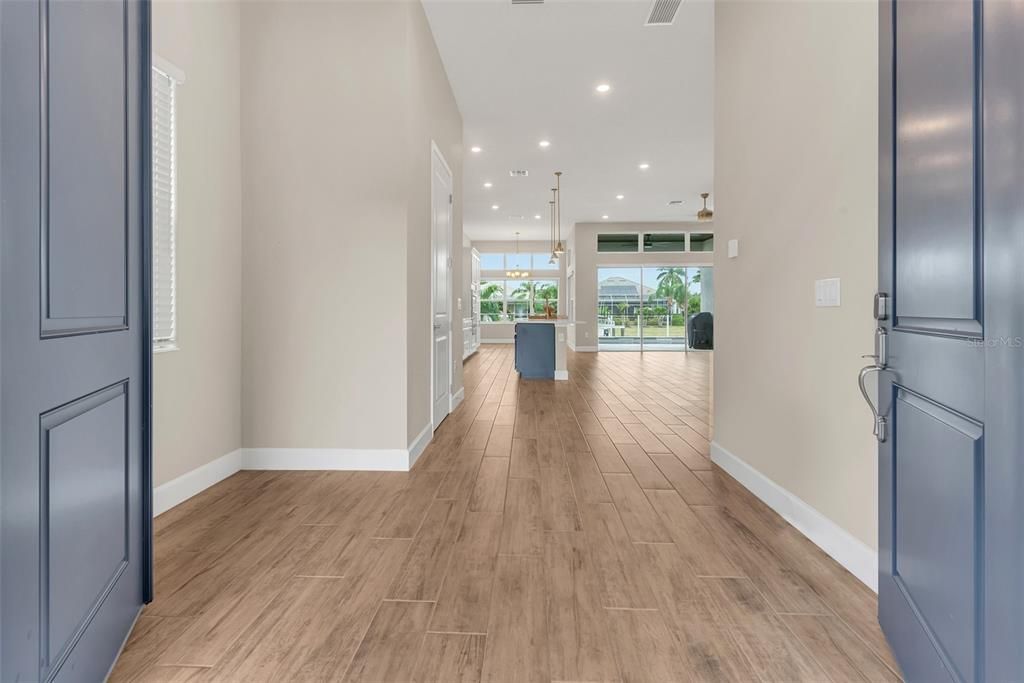 Double door entry and Wood look tile downstairs