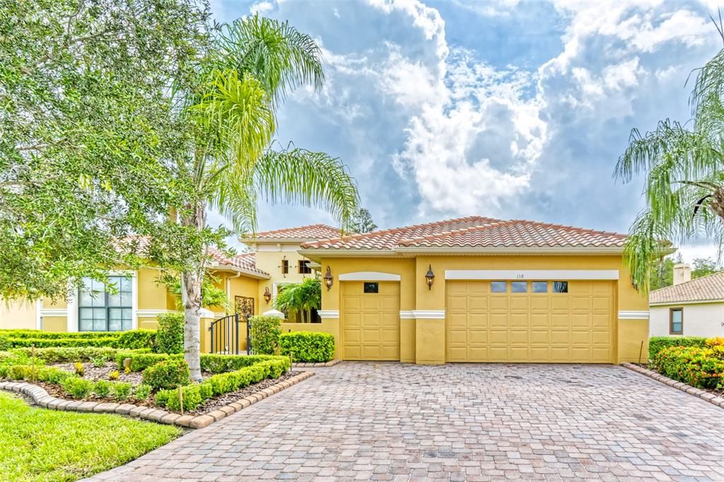 This executive home has exceptional appointments throughout - with a wide, long driveway, large garage with storage racking, and adjoining golf cart garage