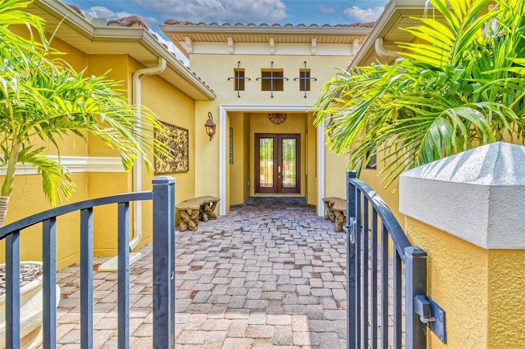 Greet your family and friends in this lovely COURTYARD with entry gate - design elements include corbels, custom trim, and iron work