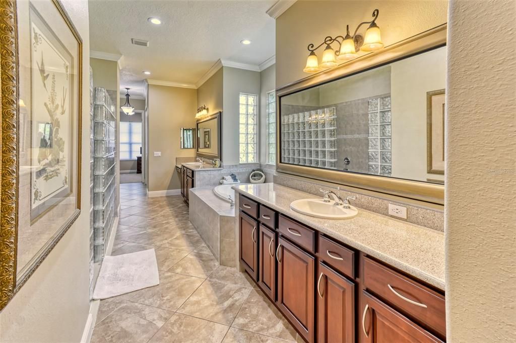 Here is the spa-inspired Owner's Bath! Dual sinks, garden tub, framed mirrors, recessed medicine cabinet, even a make-up station!