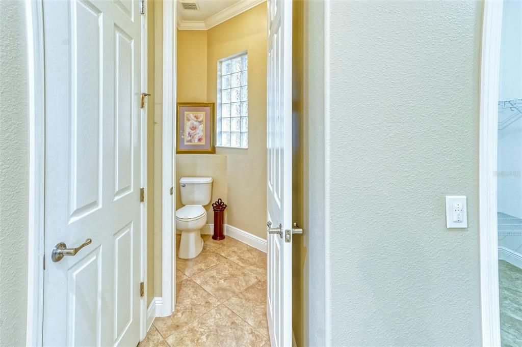 Private water closet with privacy glass block window for natural light