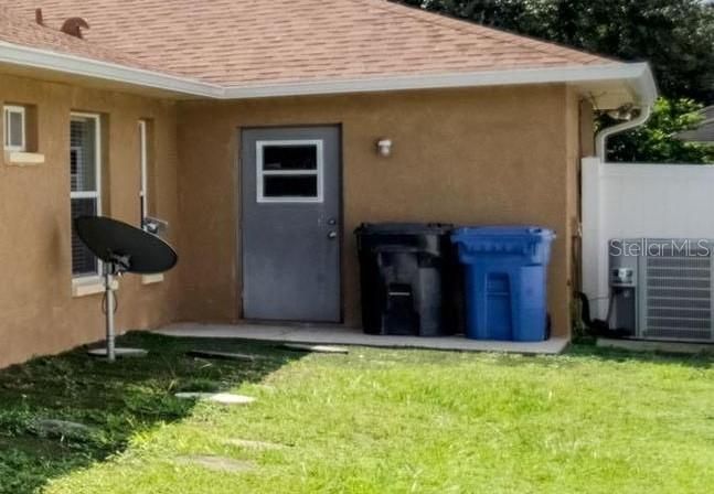 Garage door access to trash cans