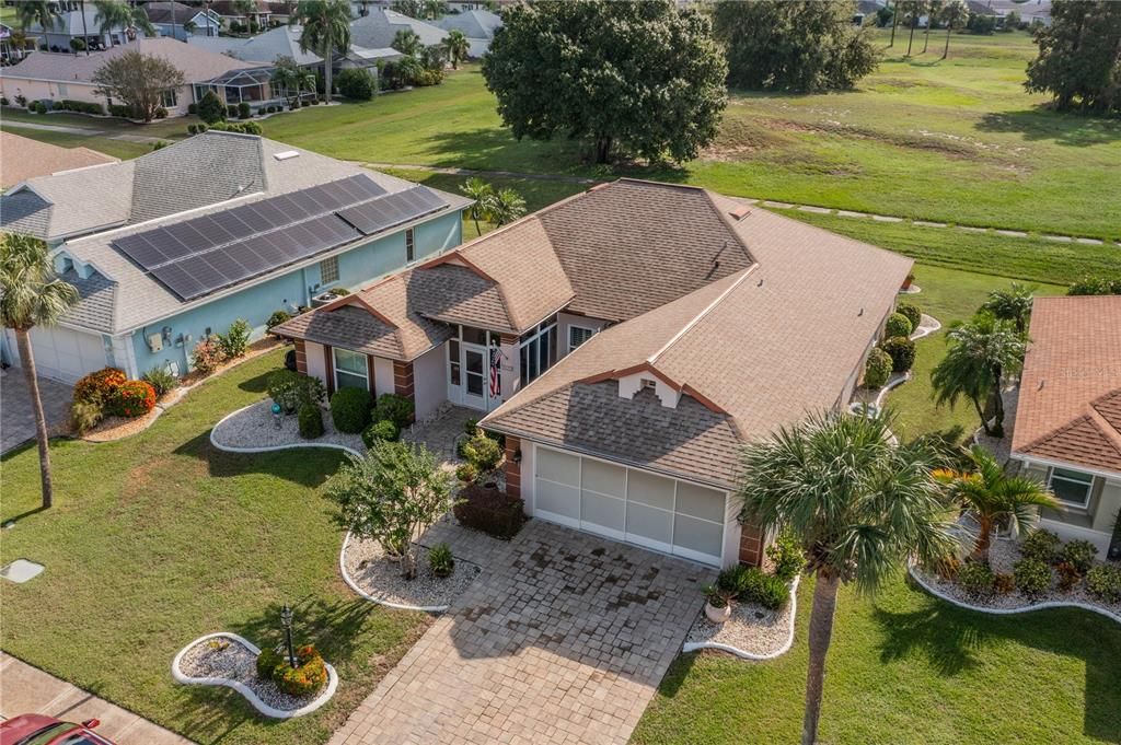 Overhead view of home and pond beyond