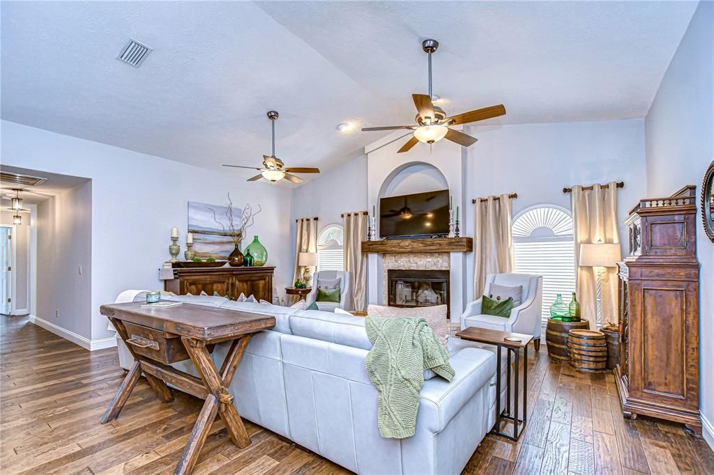 Family room with wood-burning fireplace & cathedral ceiling!