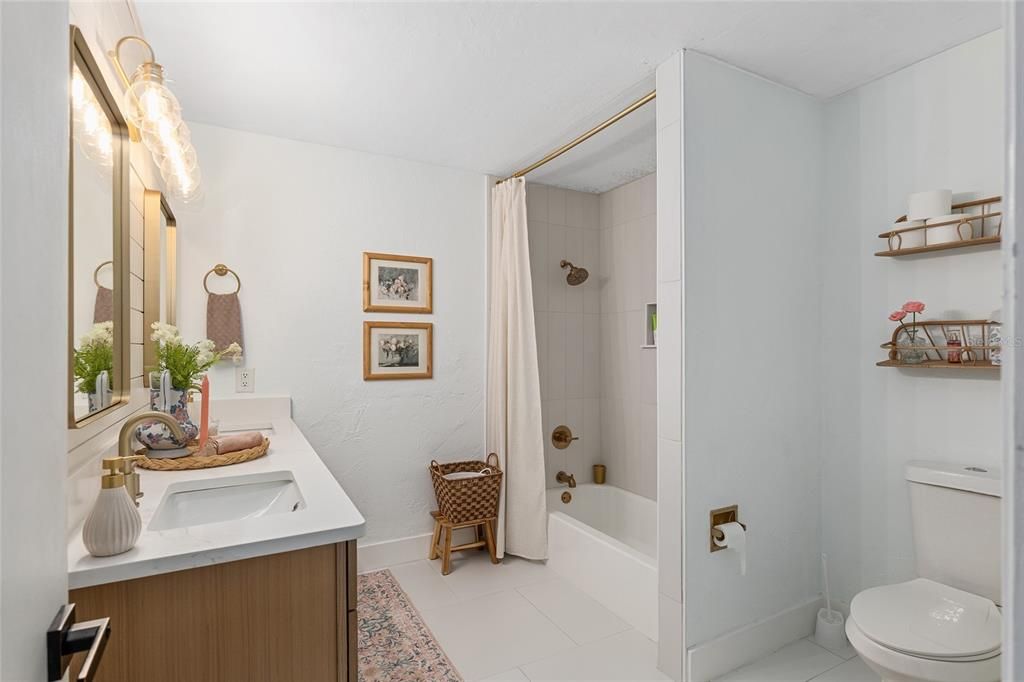 Brand new tub and vanity in fully renovated hall bath