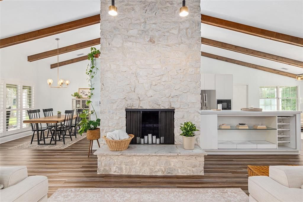 Stone wood burning fireplace as feature in great room