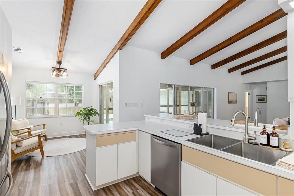 Breakfast nook or sitting area off kitchen and great room, with views of pool