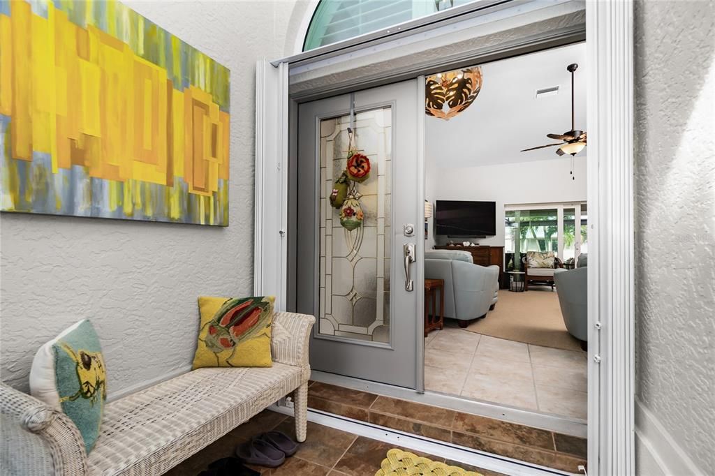 newly screened foyer and French door entry