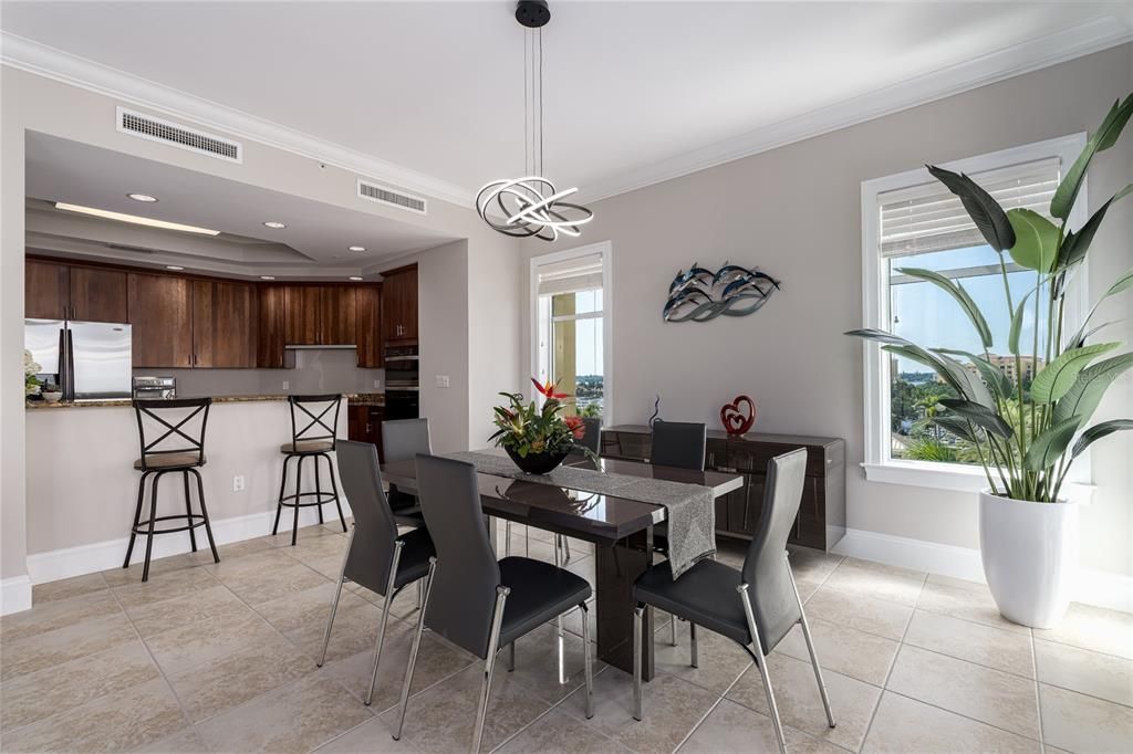 DINING ROOM WITH WATER VIEWS OF THE SOUTH BAY/MARINA AND WEST VIEWS OF THE GULF/OCEAN