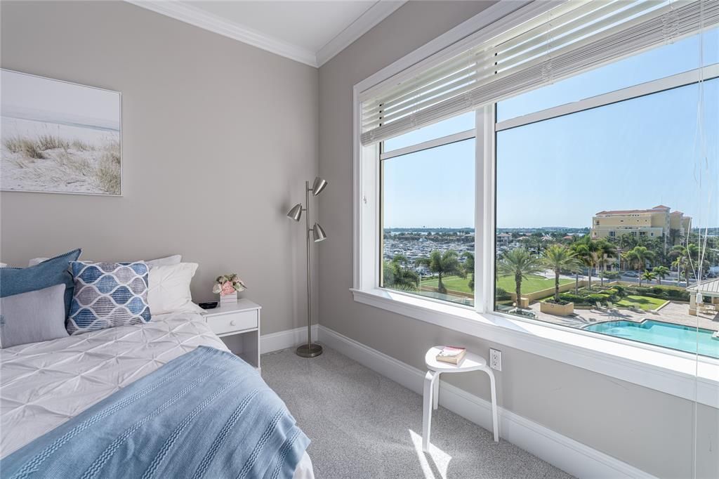 GUEST BEDROOM WITH WATER VIEW OFTHE BAY AND MARINA ON SOUTH SIDE