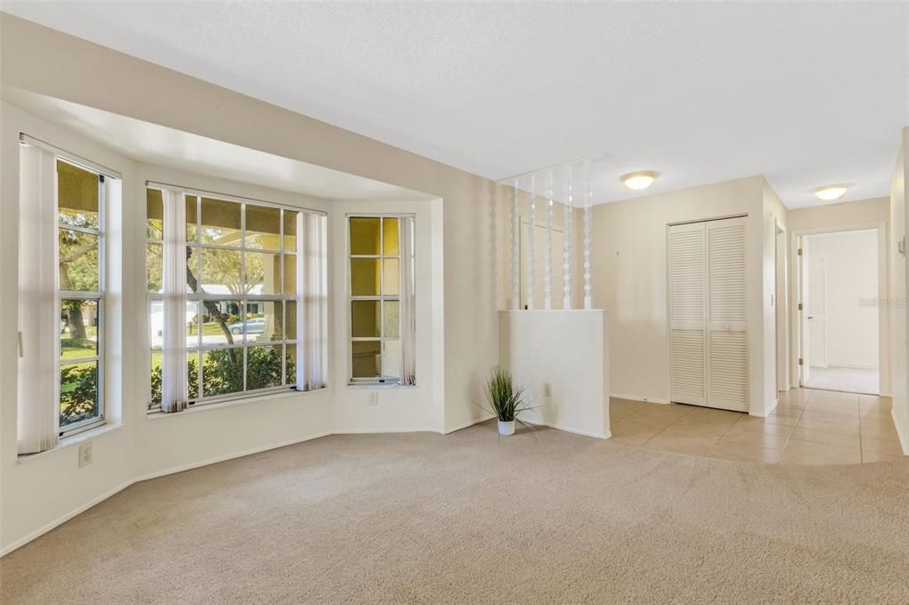 Large bay windows are the focal point of the main living area~