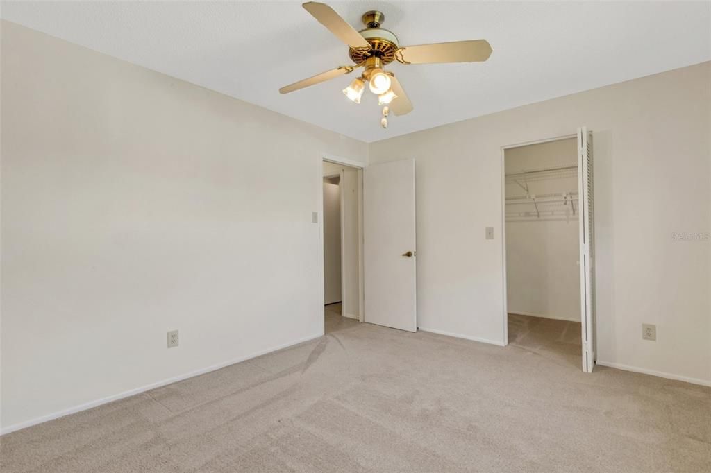 Guest bedroom conveniently located by hall bath & features a large walk-in closet~