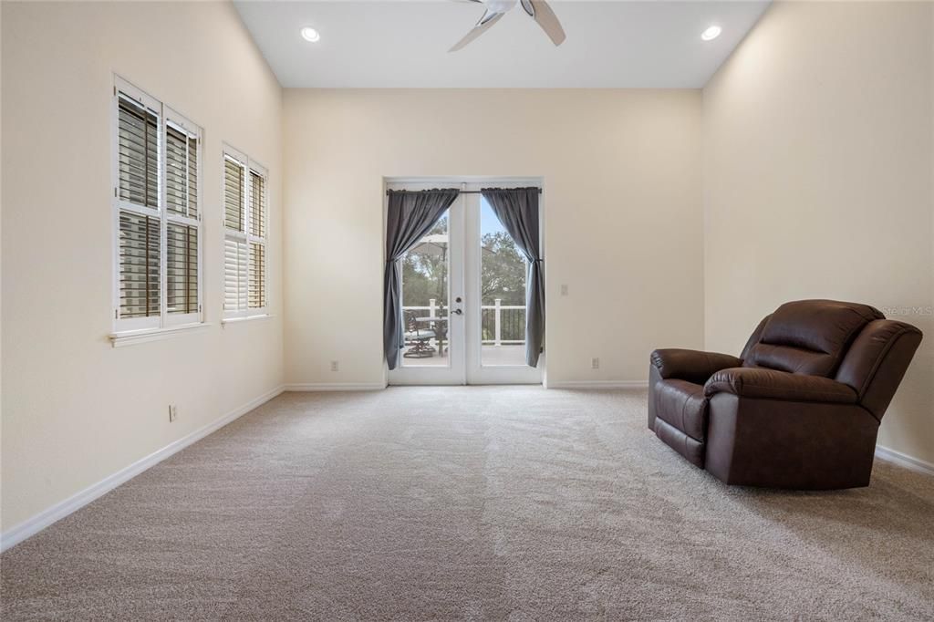 Primary suite with French doors leading to the deck