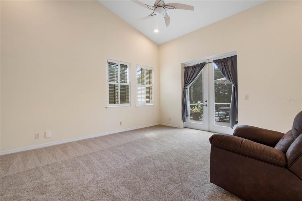 Primary suite with French doors leading to the deck