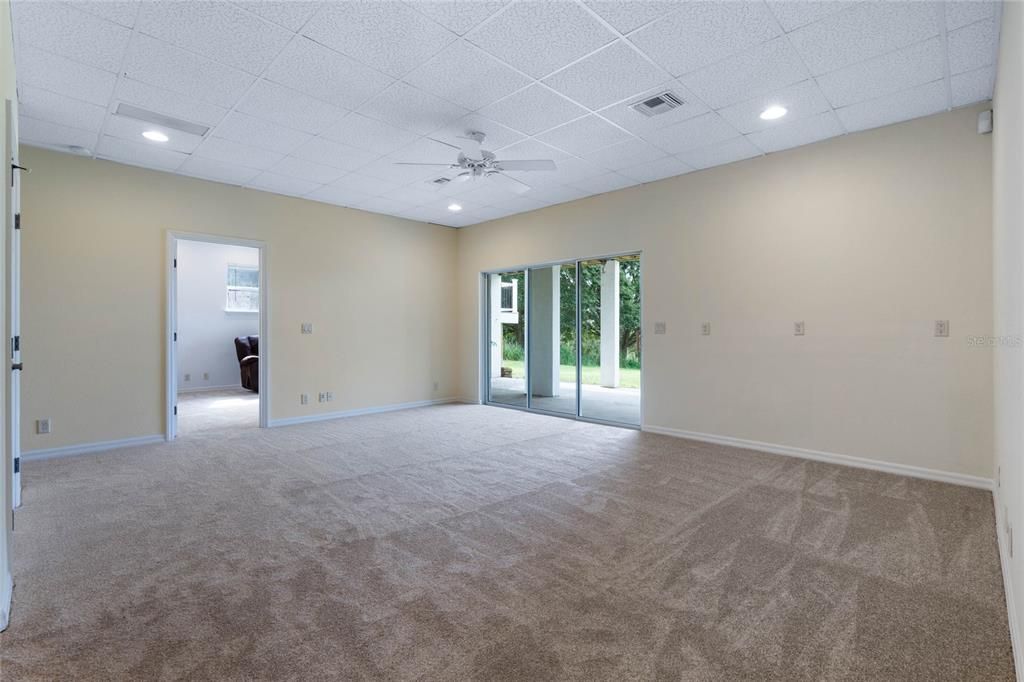 Lower level great room with sliding glass doors to a second outdoor patio