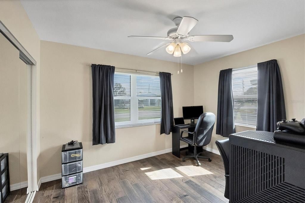 Large Second Bedroom with Wood Tile Flooring