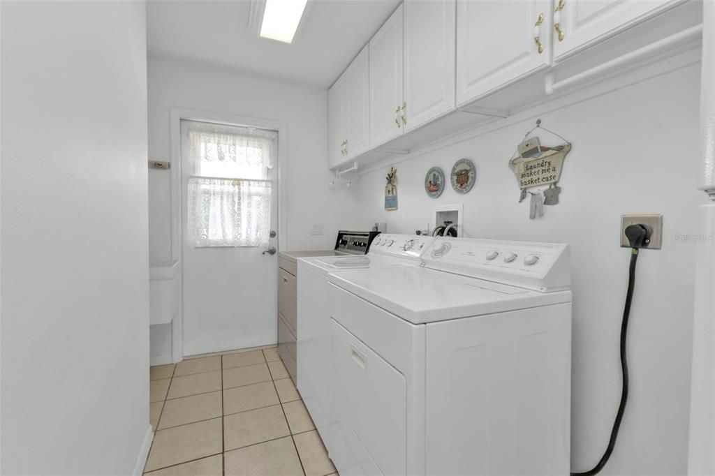 Laundry room with Full Size Washer & 2 Full Size Dryers