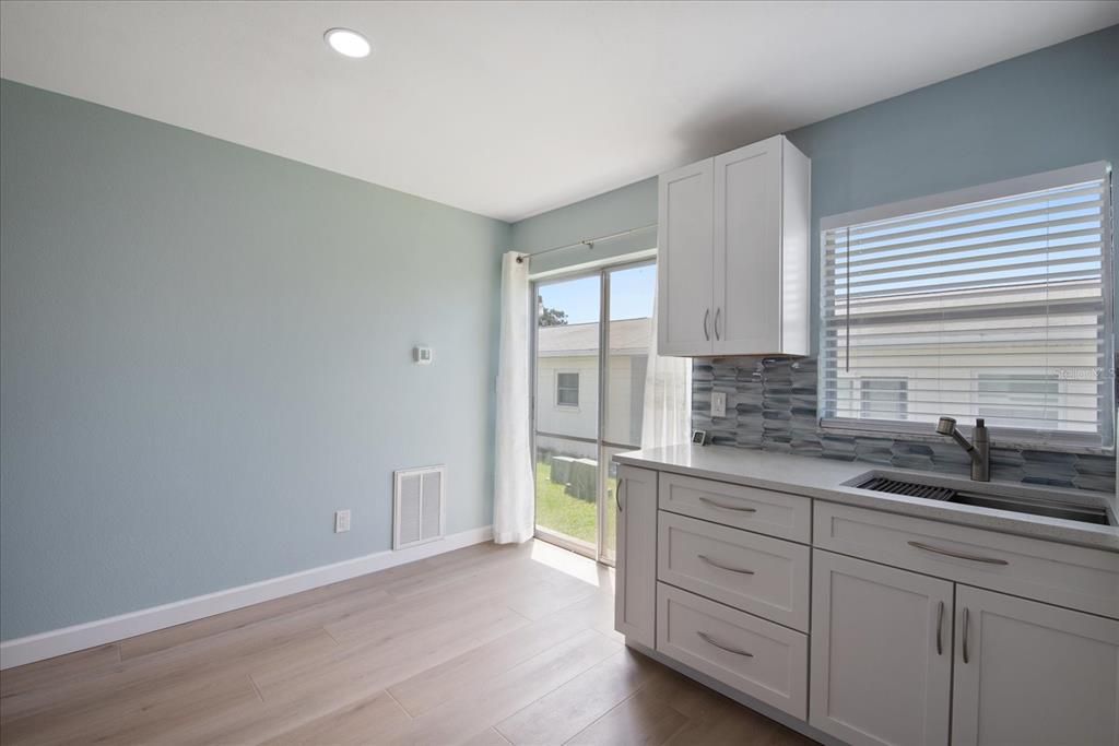 Door to laundry room and you can extend the patio