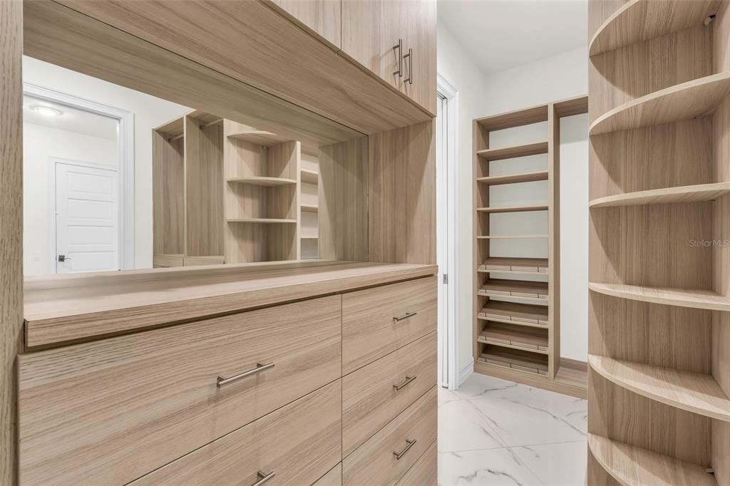 Primary bedroom walk-in closet