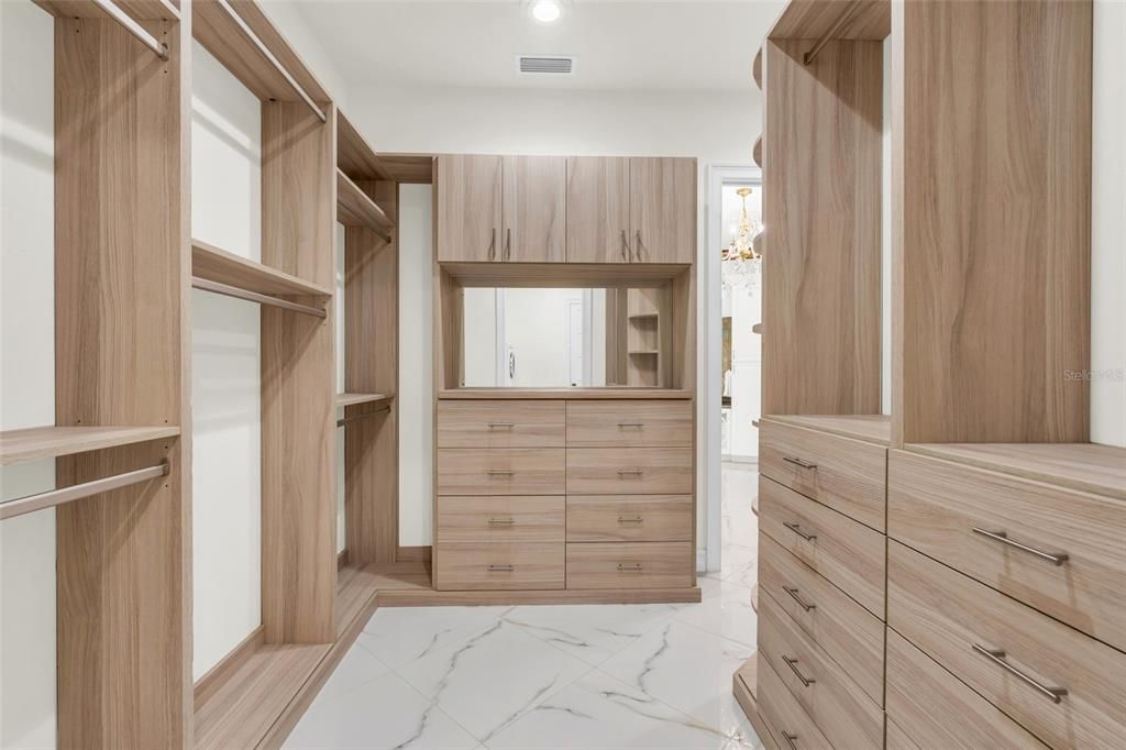 Primary bedroom walk-in closet